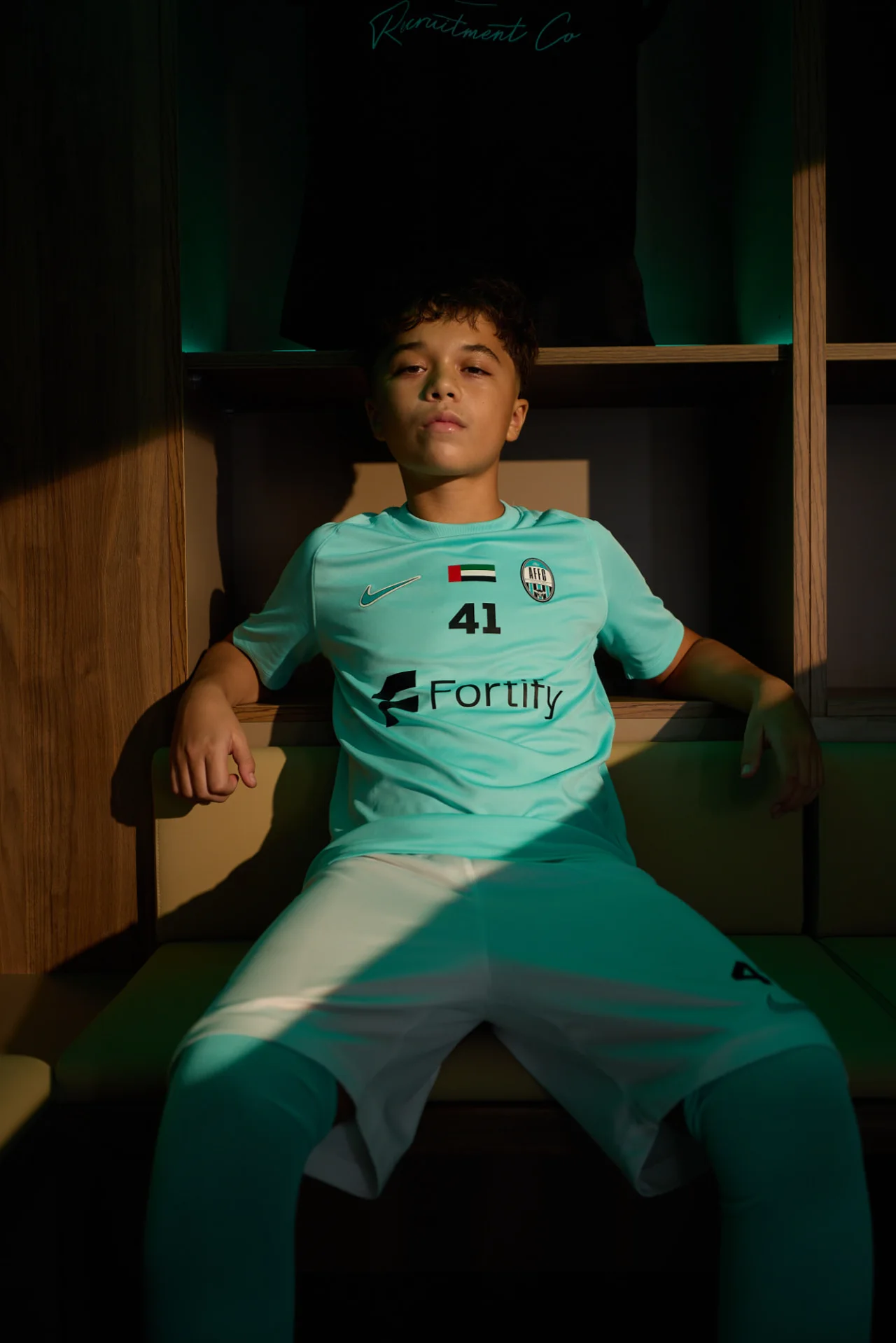 Arabian Falcons FC youth player in UAE youth competition kit
