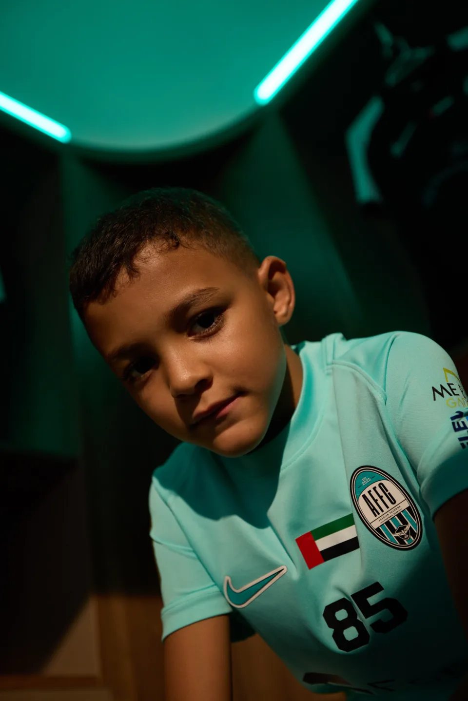 Arabian Falcons Academy player in official teal club kit