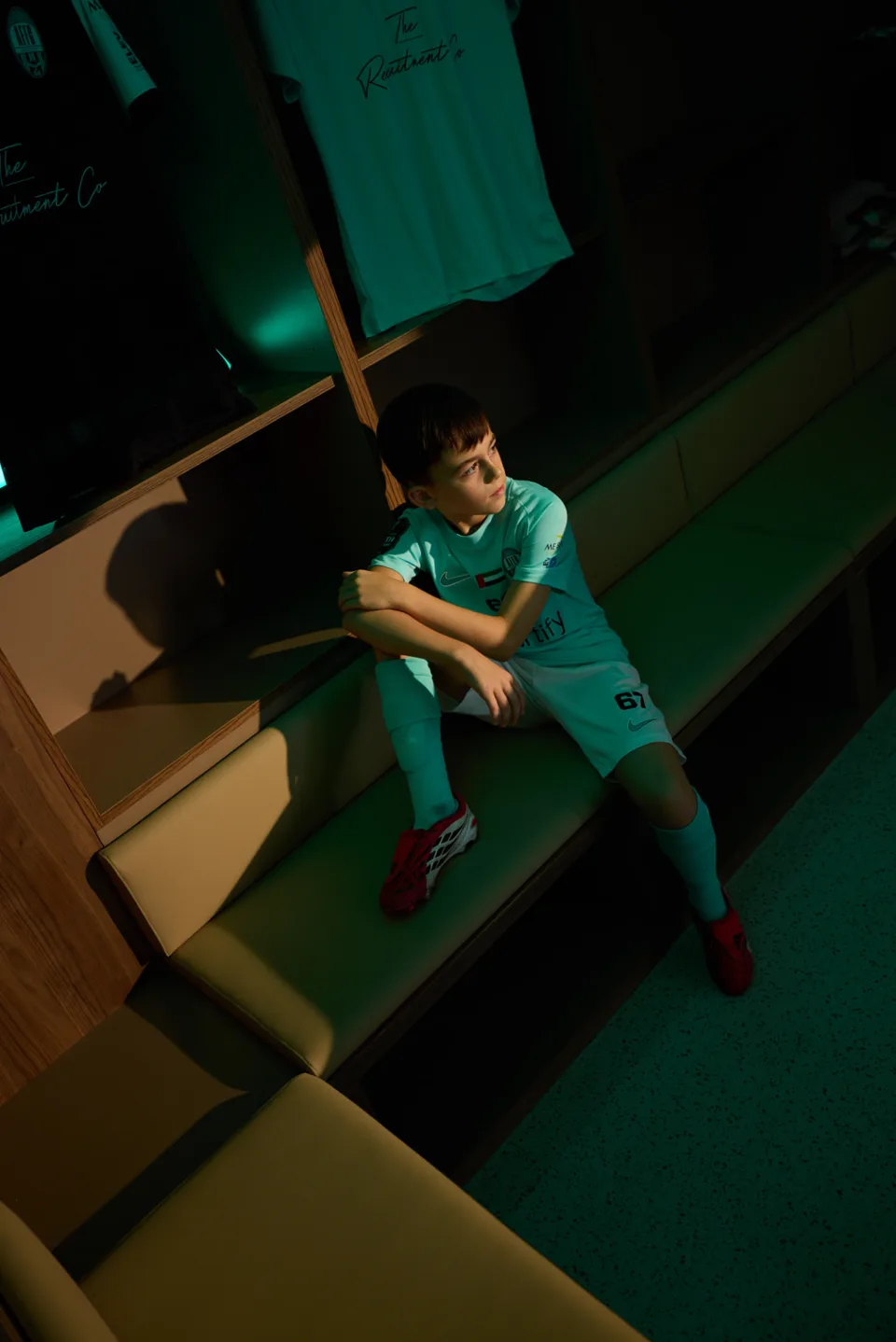 A young Arabian Falcons FC player in club kit